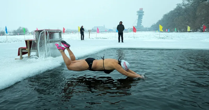 People in China Swim in Freezing River for Health, Happiness